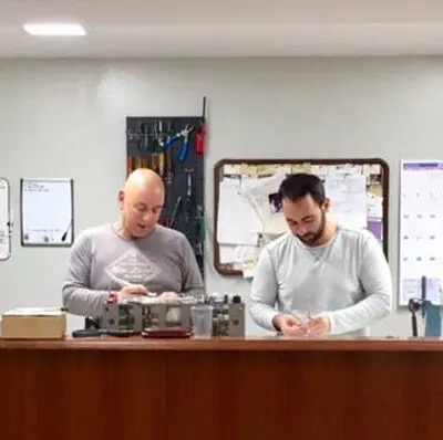 Arpino Dental technicians repairing handpieces at the bench