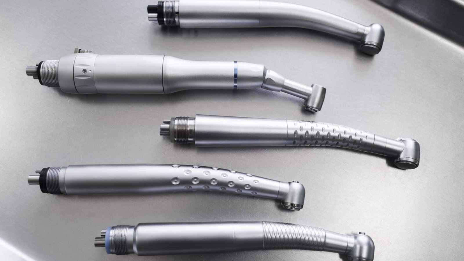 Electric and high-speed handpieces on a stainless tray