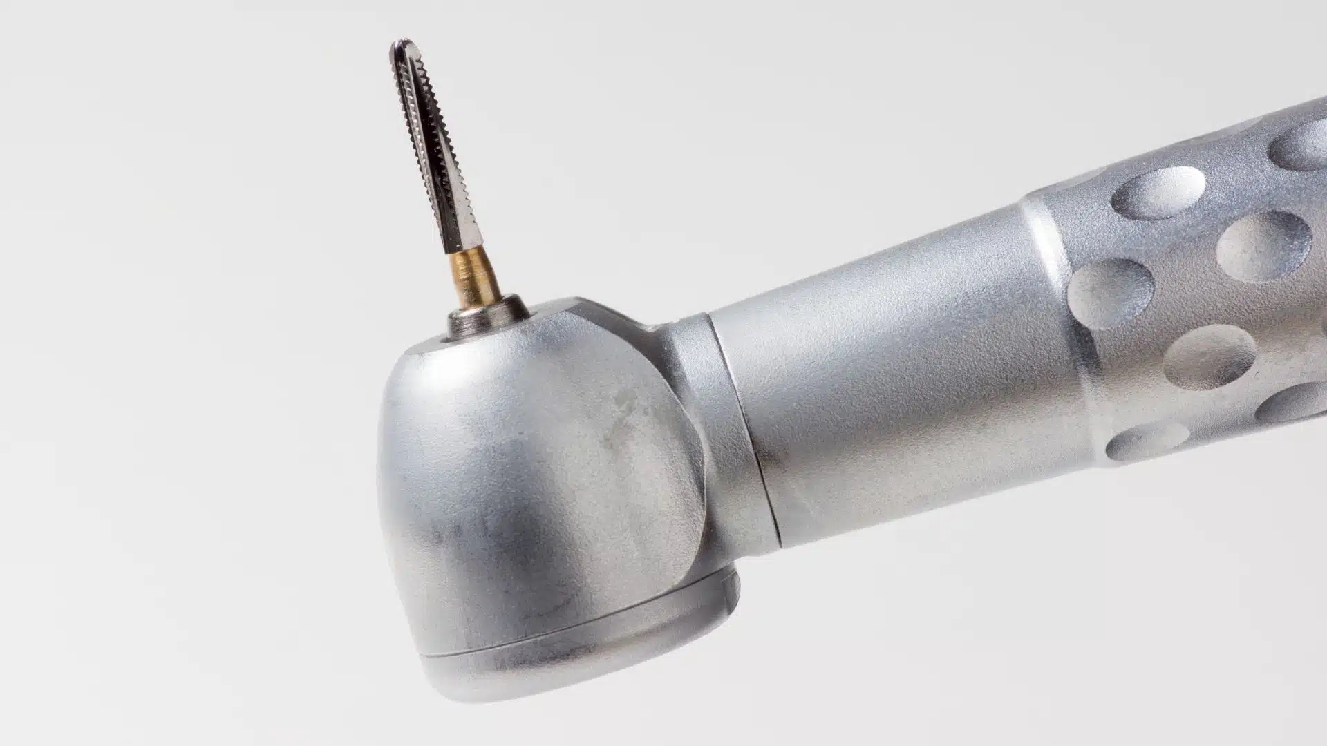 High-speed handpiece head with a bur in the chuck